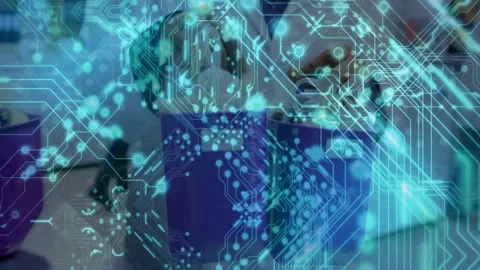 Animation overlaying digital circuit pattern on people using technology in Stock Footage 304956245