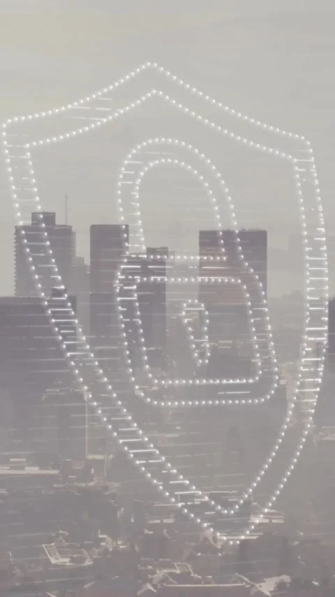 Animation of padlock and shield icon over modern cityscape Video stock 320662715