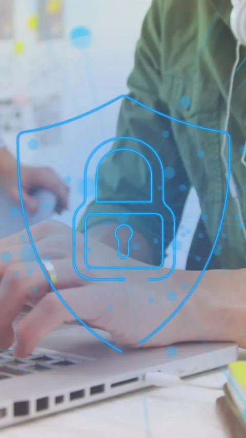Animation of padlock in shield and dots over asian man with headphones using Stock Footage 321172089