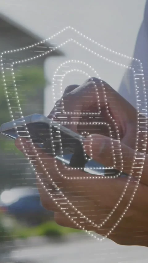 Animation of padlock in shield over midsection of caucasian man scrolling on Stock Footage 323578578