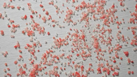 Animation particles of pink salt are collected in the shape of the heart Stock Footage 143620104