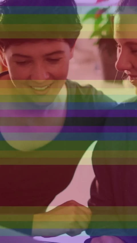 Animation of pride rainbow stripes over happy caucasian lesbian couple using Vídeo Stock 342643630