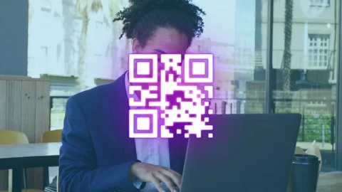 Animation of qr code over businessman with dreadlocks and mustache using laptop Stock Footage 329857856