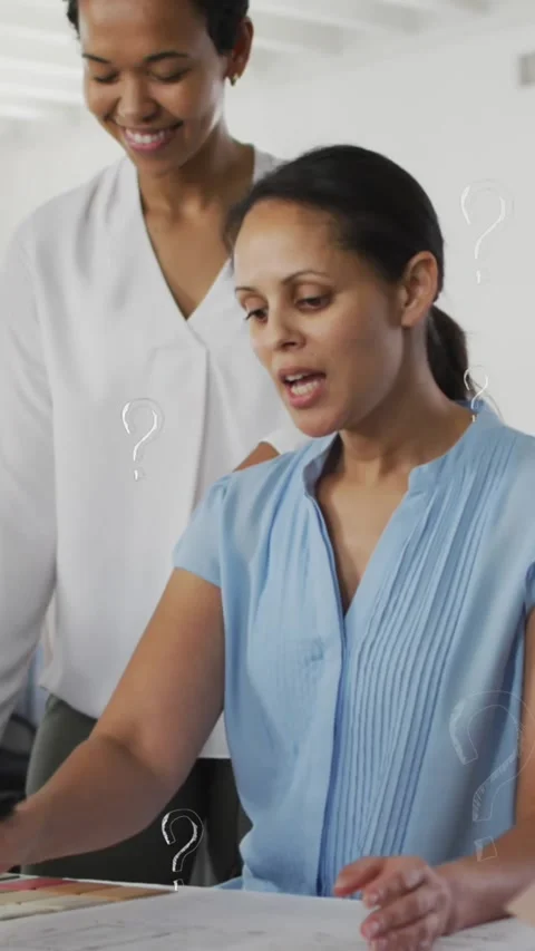 Animation of question mark symbols over multiracial coworkers discussing in Stock Footage 343615507