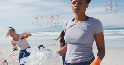 Animation of question marks over biracial female volunteer picking up rubbish on Vídeos de archivo 171352505