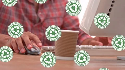 Animation of recycling signs falling over man typing on computer keyboard Stock Footage 329765890