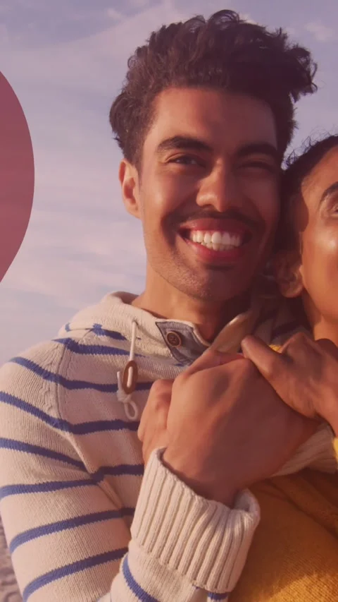 Animation of red heart over couple in love embracing on beach Vídeo Stock 342910052