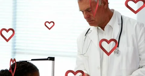 Animation of red pattern over caucasian male doctor using tablet Stock Footage 327644009