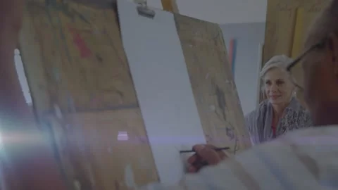 Animation of red pattern over caucasian female doctor using tablet Stock Footage 327847074