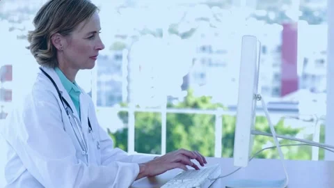 Animation of red pattern over caucasian female doctor using computer Stock Footage 330287454