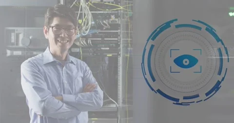 Animation retina round scanner against asian male engineer smiling at computer Stock Footage 329033540
