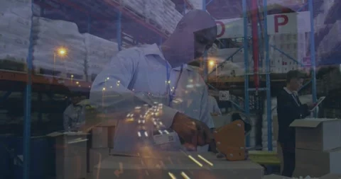 Animation of road at night over diverse workers in warehouse Stock Footage 328829534