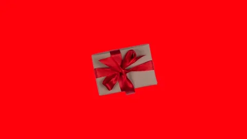 Animation of a rotating and approaching gift box with a red bow on a red Stock Footage 229181358