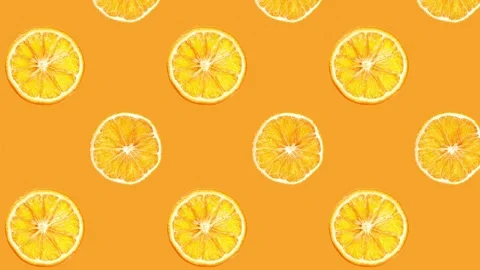 Animation. rotating dried oranges on an orange background. dried oranges Stock Footage 235056506