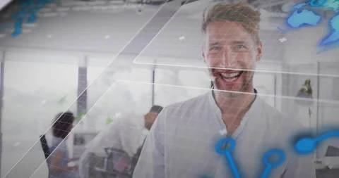 Animation of rotating globe and computer language over smiling caucasian man Stock Footage 328358018