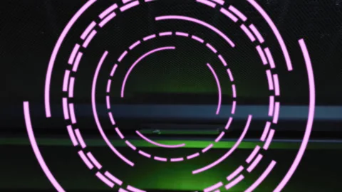 Animation of rotating pink circular scanner processing over dark server room Stock Footage 312304494