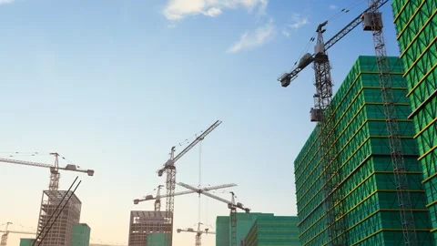 Animation of rotating tower cranes at real estate construction sites Stock Footage 325759873