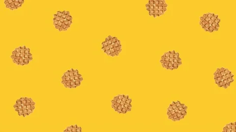Animation of rotating waffles on a yellow background Stock Footage 202002935