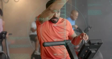 Animation of scanner processing data over man cross training on elliptical at Stock Footage 328500873