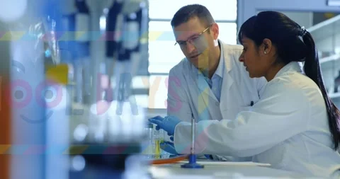 Animation of school days text over diverse scientists in lab Stock Footage 328014624