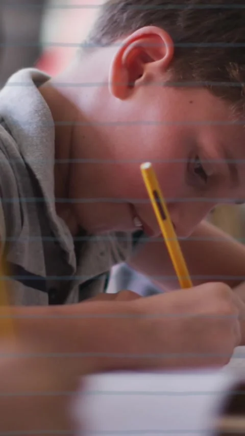 Animation of school items icons moving over schoolchildren learning Stock Footage 343902056
