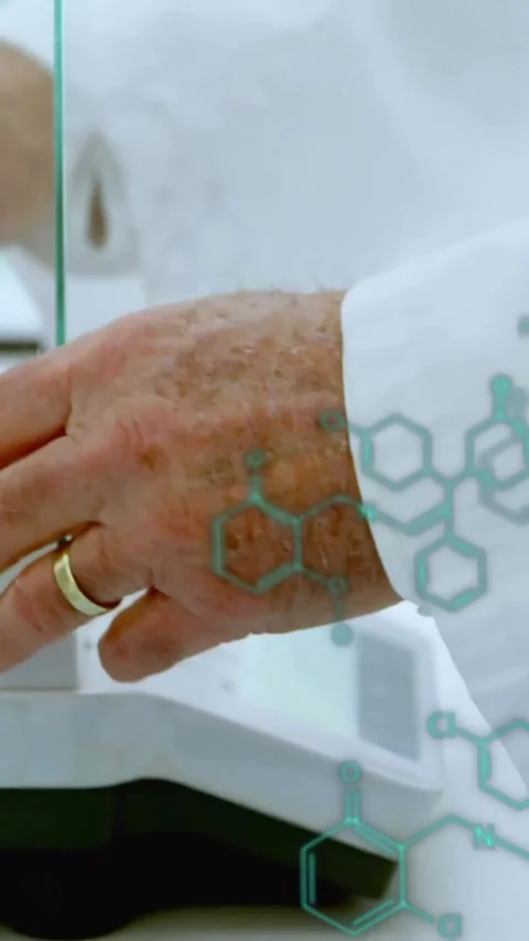 Animation of scientific data processing over caucasian male scientist in Stock Footage 323780659