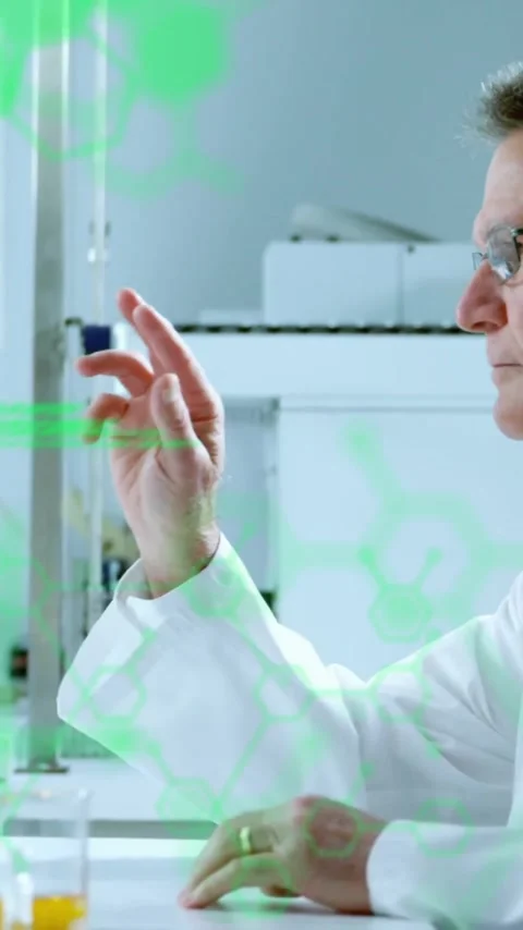 Animation of scientific data processing over caucasian male scientist in Stock Footage 343504774