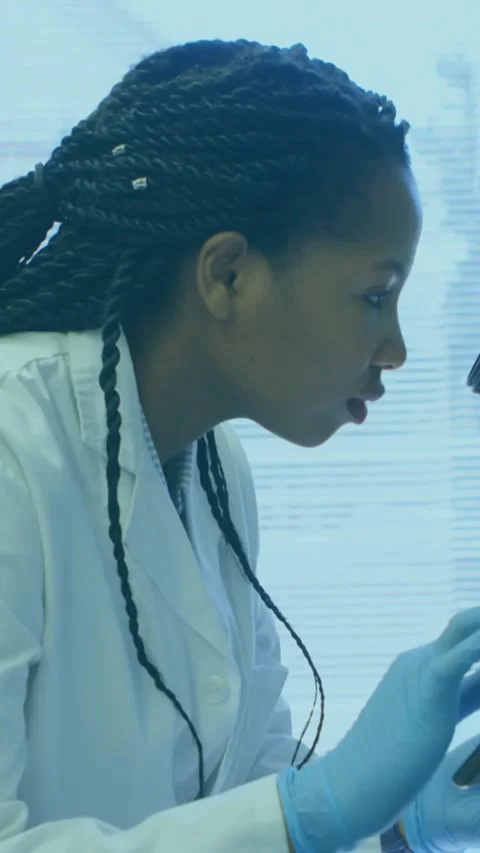 Animation of scientific data processing over african american female scientist Stock Footage 344525599