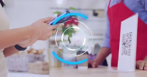 Animation of scope scanning over diverse shop assistant and customer paying with Stock Footage 229196029
