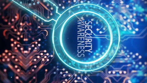 Animation of security awareness text and circuit board over black background Stock Footage 312423206