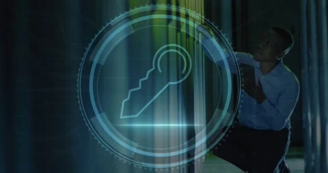 Animation of security key icon over african american male engineer using tablet Stock Footage 326422239