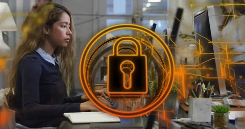 Animation of security padlock icon against woman using computer at office Stock Footage 330658313