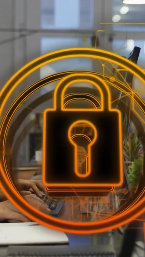 Animation of security padlock icon against woman using computer at office Stock Footage 344679764