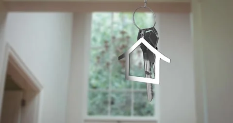 Animation of silver key and house key ring over blurred house interior Stock Footage 316580984