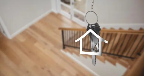 Animation of silver key and key ring over blurred house interior Stock Footage 316580996