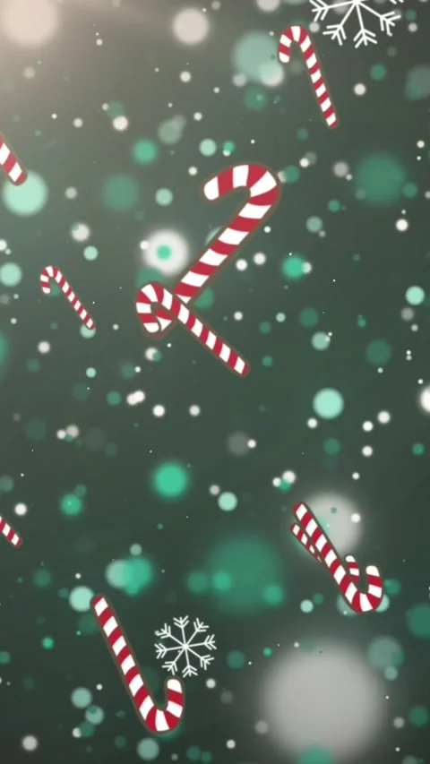 Animation of snow and christmas candy canes falling over green background Stock Footage 342805731