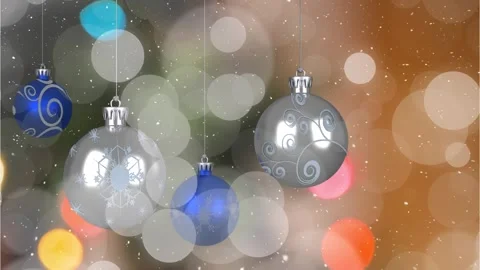 Animation of snowfall and looping bokeh effect over hanging multicolored baubles Stock Footage 327957968