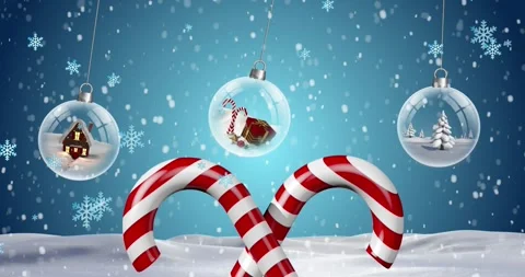 Animation of snowflakes falling over hanging snowglobes and candy cane on winter Stock Footage 330728891