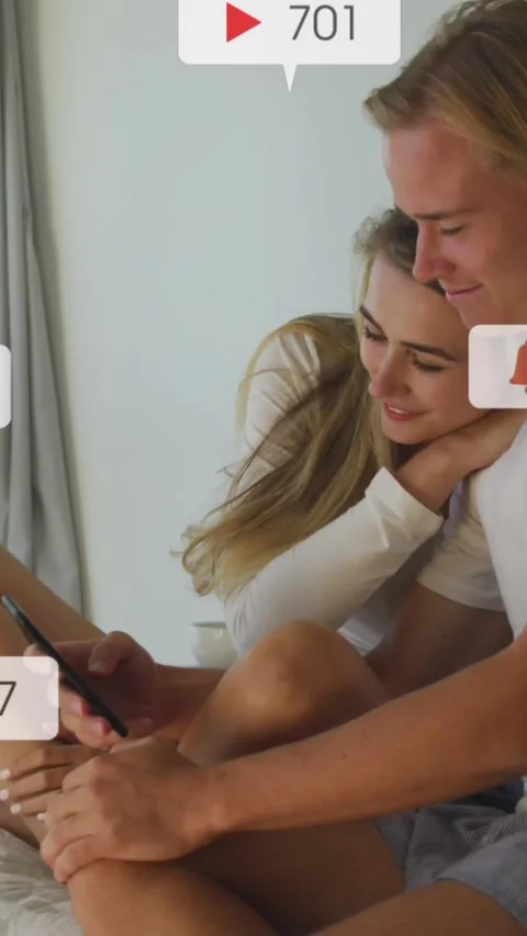 Animation of social media notifications over smiling couple sitting on bed using Vídeo Stock 342136390