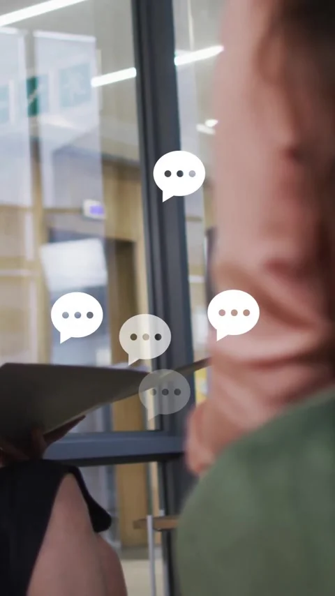 Animation of speech bubbles over diverse business people discussing work Stock Footage 342812442