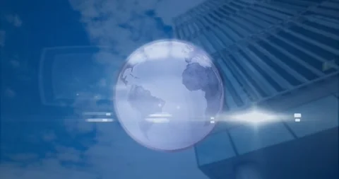 Animation of spinning globe and light spot against low angle view of tall 動画素材 245403144