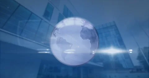 Animation of spinning globe and light spot against low angle view of tall 動画素材 327524572
