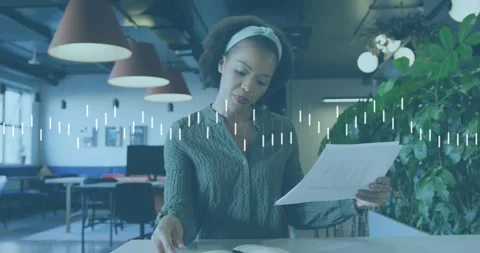 Animation of statistical data processing against african american woman reading Stock Footage 329032164
