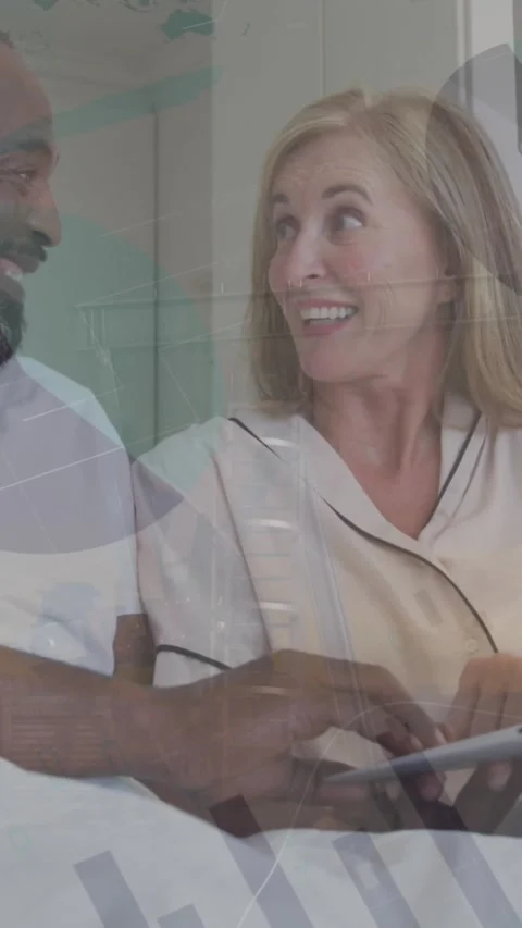 Animation of statistical data processing over happy couple using laptop in the Vídeo Stock 343920556