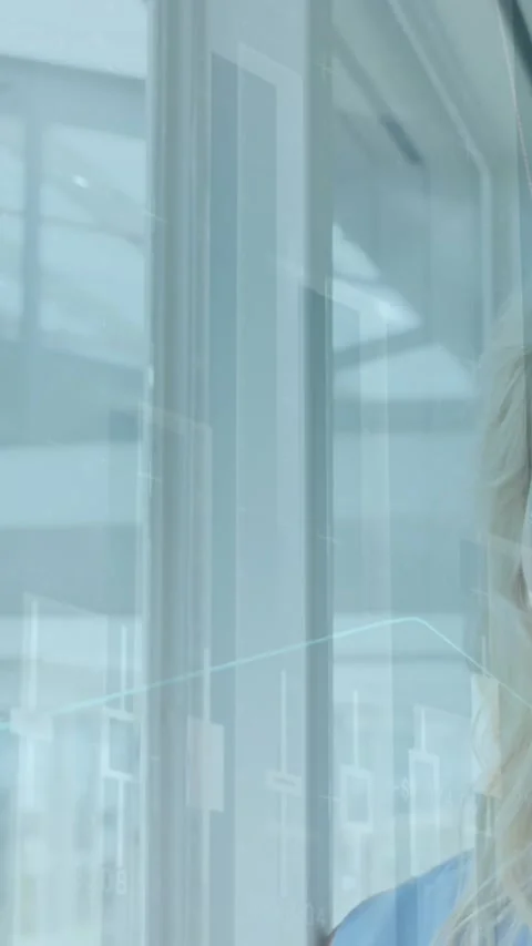 Animation of statistical data processing over caucasian woman looking out of the Stock Footage 344706242