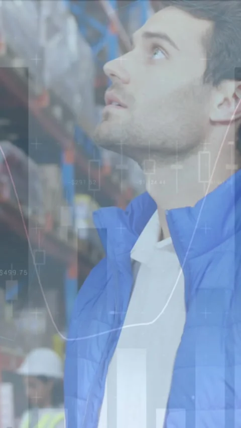 Animation of statistics and financial data processing over man working in Stock Footage 342009658