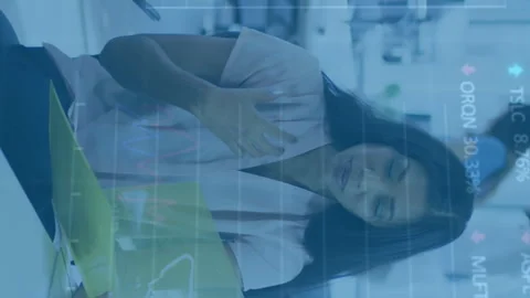 Animation of stock market data processing over two diverse women discussing over Stock Footage 312288773