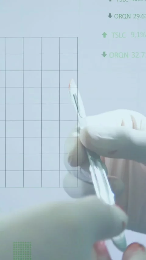 Animation of stock market data processing over mid section of a surgeon holding Stock Footage 322955271