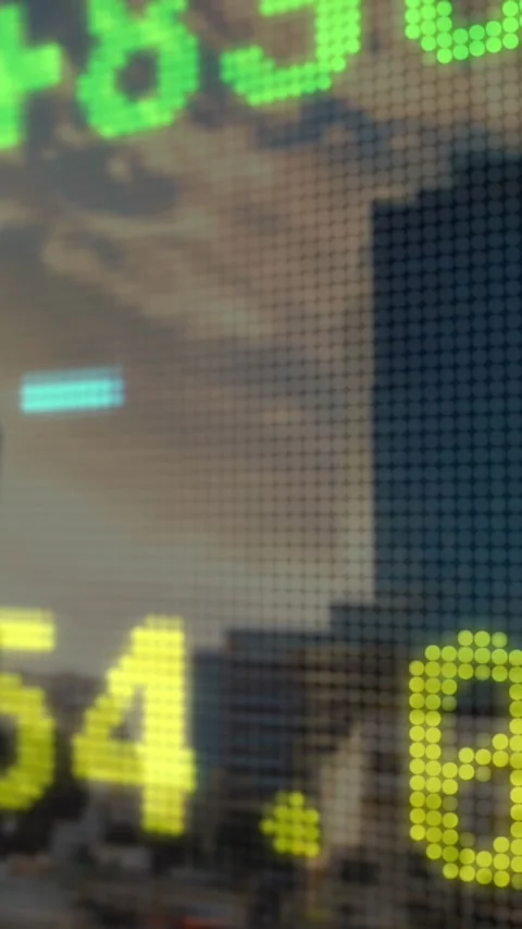 Animation of stock market data processing against view of tall buildings Stock Footage 344636761