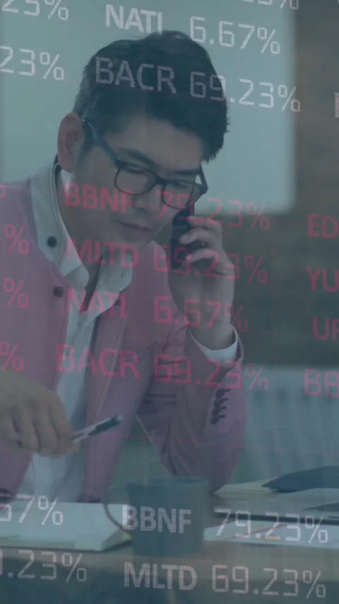 Animation of stock market data processing against asian businessman talking on Stock Footage 344766325